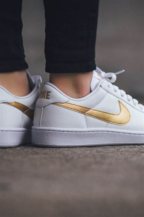 women's white and gold sneakers.